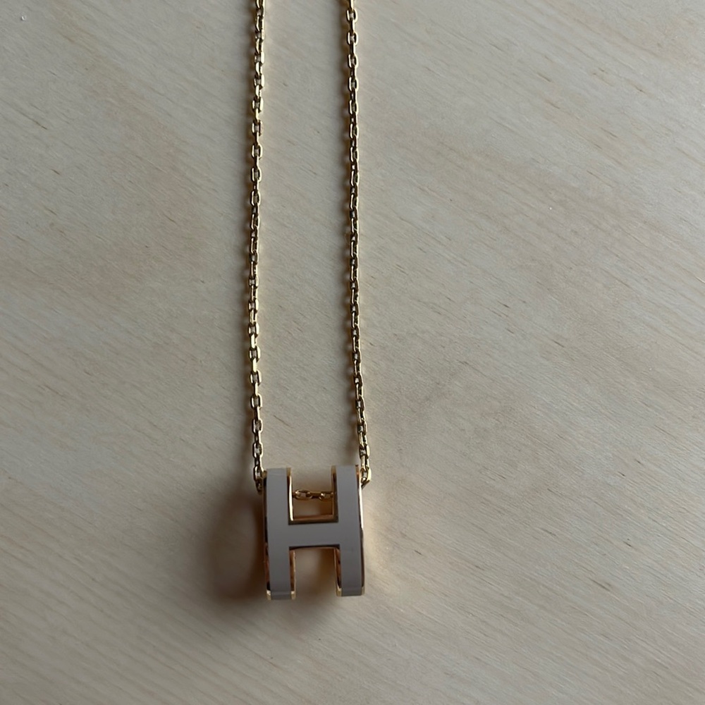 Hermes Mini Pop H pendant in color Marron Glace